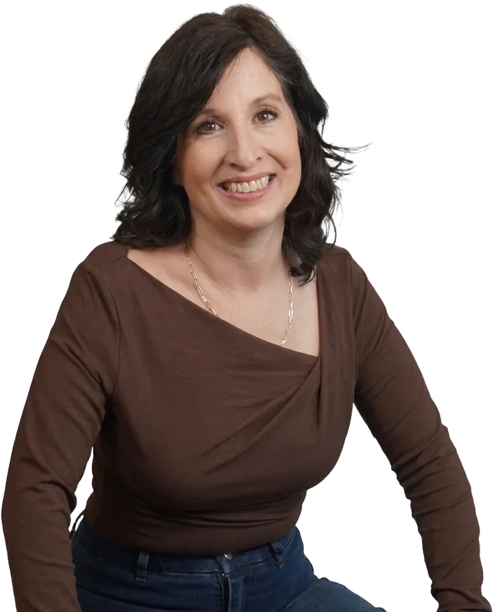 Kristen Zuray, founder of The Adi Project, smiling in a brown top