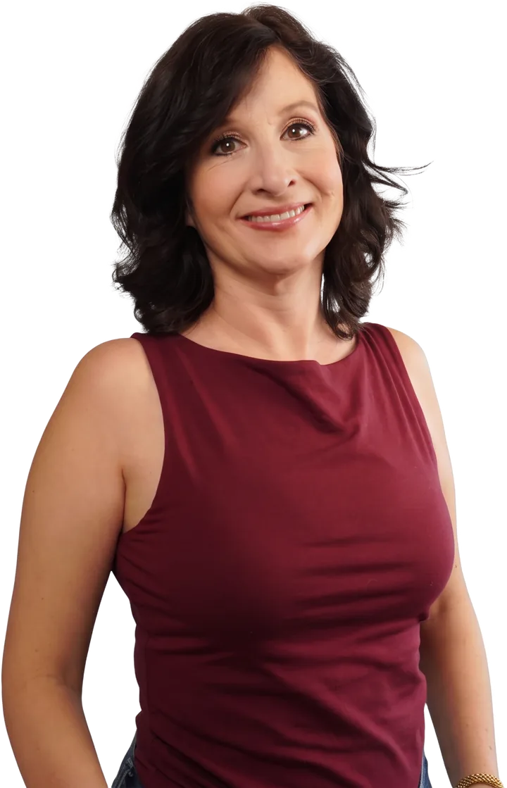 Kristen Zuray, founder of The Adi Project, smiling in a burgundy top